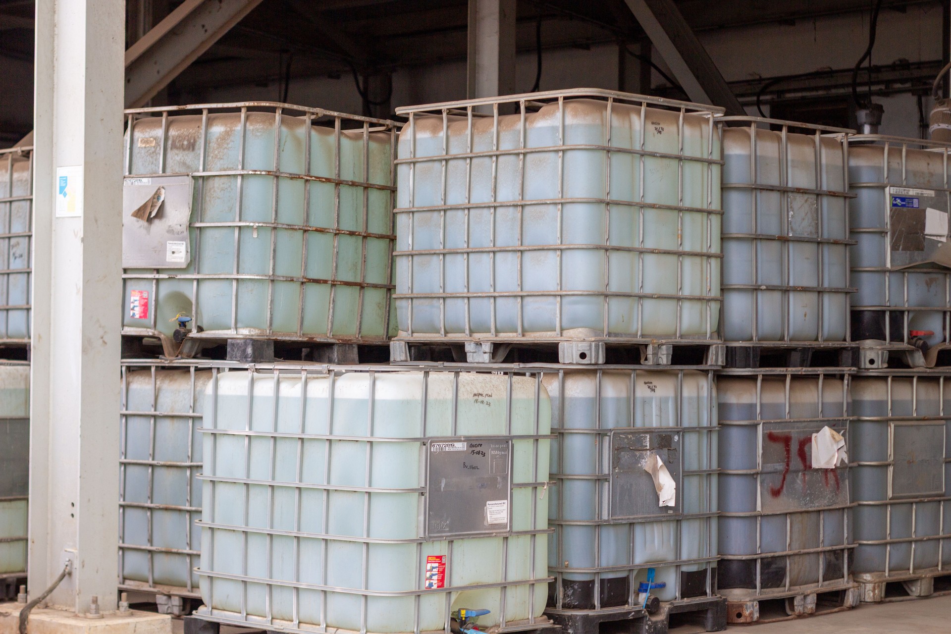 Stockpile of Intermediate Bulk Containers in a Warehouse Interior for Storage and Logistics Solution